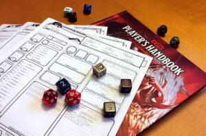 D&D character sheet and dice